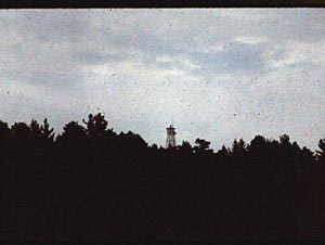 Kahshahpiwi fire tower from a 
               distance, 1979